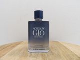 a close up of a bottle of perfume on a wooden table