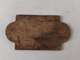 a close up of a piece of metal on a white surface