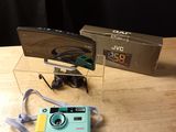 a small camera sitting on a table next to a box