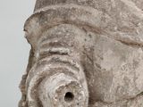 a statue of a man with a hat on it ' s head