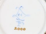 an image of a close up of a plate with a cartoon character on it