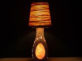 a lamp that is sitting on a table in the dark