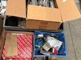 many boxes of assorted electronics on the ground