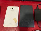 a cell phone that is sitting next to a charger