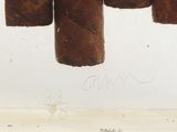 a close up of a cigar on display in a glass case