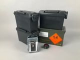 two black boxes and a green box with a yellow tag on it