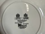 a white plate with a black and white design on it