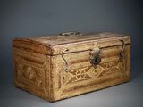 a wooden box with a handle on a gray background