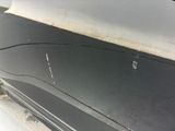 a close up of a car door with a hole in it