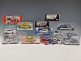 many different models of cars in a display case
