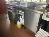 a kitchen with a sink and a dishwasher in it