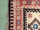 a picture of a rug hanging on a wall