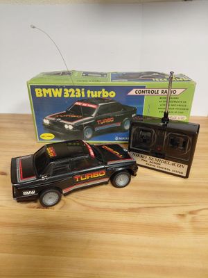 a black toy truck with a radio on top of it