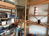 a room that has a lot of items on the shelves