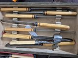 a box with a bunch of knives in it