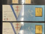four different stamps are on display in a display case