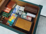 a wooden box filled with books and other items