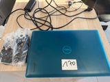 a blue laptop sitting on a wooden table with wires attached to it