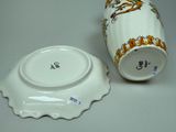 a white cup and saucer sitting on a table