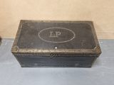 a small black box with a monogram on it