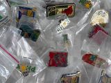 a lot of pins in a bag on a table