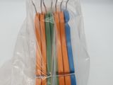 four forks in a plastic bag on a white table