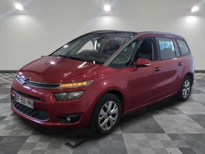 the red citrole is parked on a checkered tile floor