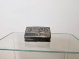 a glass table with a small box on top of it