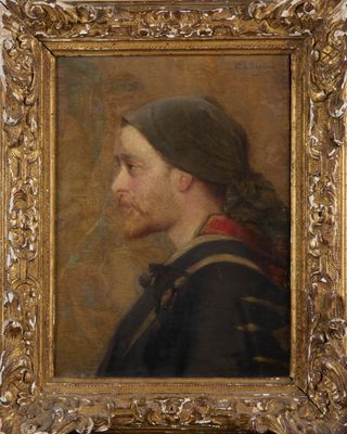 portrait of a man with a beard in a gold frame