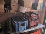many boxes and crates on the shelves in the garage