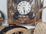 a clock that is sitting on a table next to some baskets