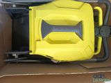 a box with a yellow and black vacuum in it
