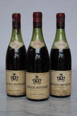 three bottles of wine sitting on top of a table next to each other