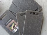 three cutting boards sitting on the floor next to each other