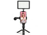 a close up of a cell phone with a camera on a tripod