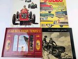 three books on a white table with a picture of a man driving a car