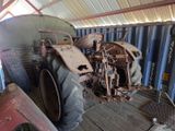 a tractor that is parked inside of a building