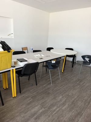 a room with a table and chairs in it