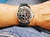 a man that is wearing a watch on his wrist