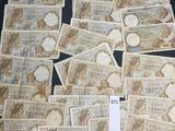 a lot of different bank notes on a black table