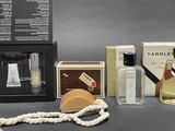 a bottle of perfume and a box of soap on a table