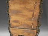 an image of a wooden chair with a carved back and legs
