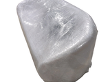 a large piece of ice sitting on top of a white surface