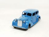 a blue toy car that is sitting on a white surface