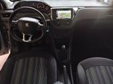 the interior of a small car with a steering wheel and dashboard