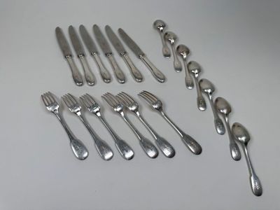 a lot of forks and spoons that are on the table