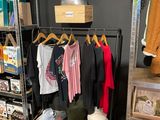 a display of clothing on a rack in a store