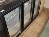 an image of a kitchen with a refrigerator and a counter