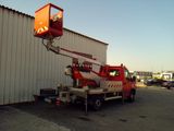 a red crane that is sitting on the back of a truck