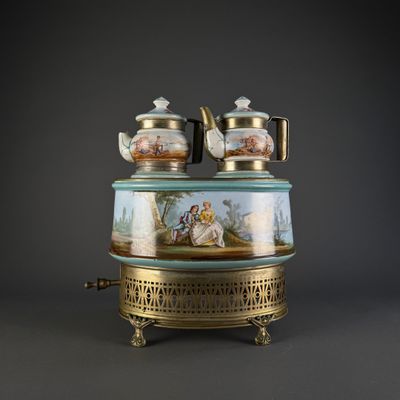 a picture of a tea pot and tea pot on a stand